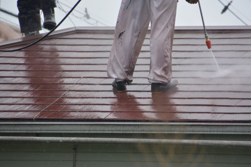 Technician performing powerwashing